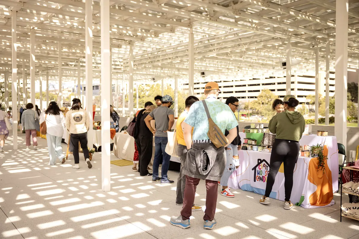 Visitors buzz through the Waterloo Community Market pop-up market featuring more than 20 local artists and entrepreneurs on Sunday, March 10, at Meredith Heritage Tree Deck in Waterloo Park. Delta partnered with Waterloo Greenway and Future Front Texas to host the event.