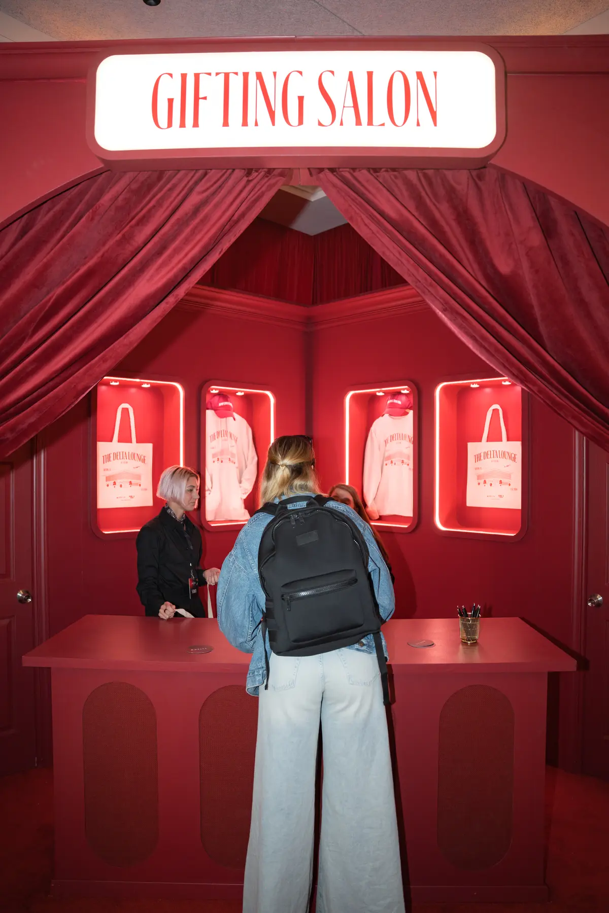 A SkyMiles member stops by the Gifting Salon in the Delta Lounge, an exclusive merch station where lounge goers were given a ticket to redeem custom limited-edition Delta x SXSW merchandise such as hats, tote bags and sweatshirts.