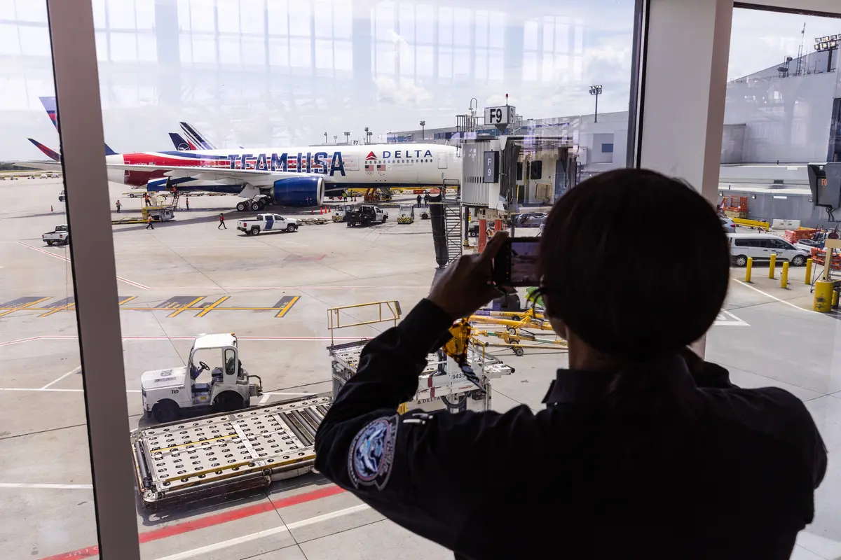 Someone takes a photo of Delta's Team USA plane as it lands in Atlanta, Georgia.