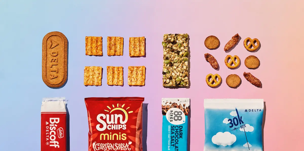 All Delta customers on flights over 499 miles can choose from one of four sweet or savory snacks, including: Lotus Biscoff cookies, 88 Acres dark chocolate sea salt seed and oat bar, 30K snack mix or SunChips Garden Salsa flavored whole grain snacks. 