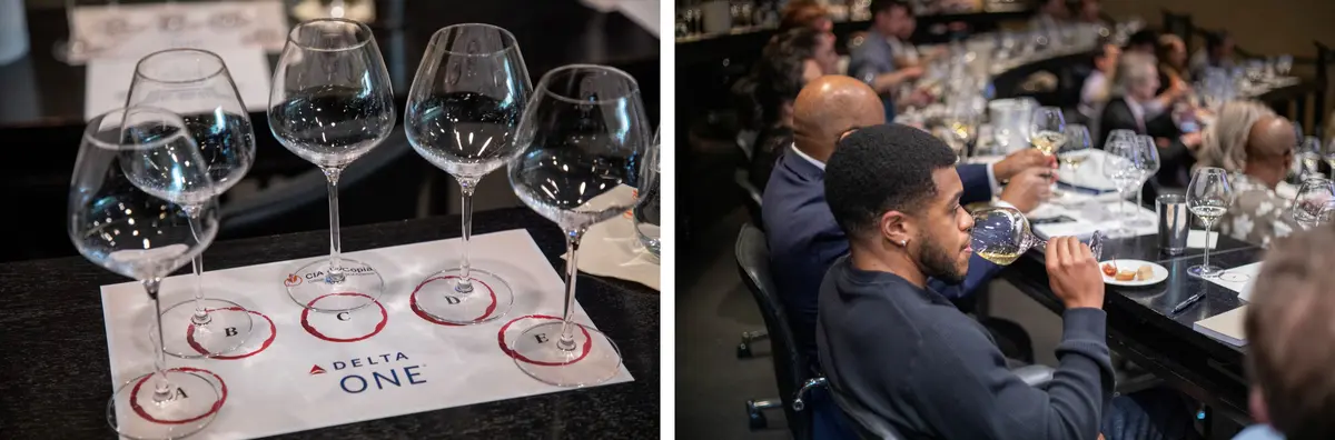 Guests participate in a Delta One wine tasting with multiple wine samples and tasting glasses.