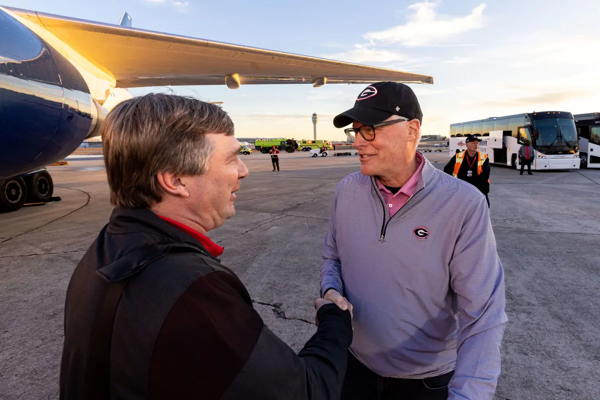 CEO Ed Bastian greets UGA head coach Kirby Smart on Jan. 10, 2023.