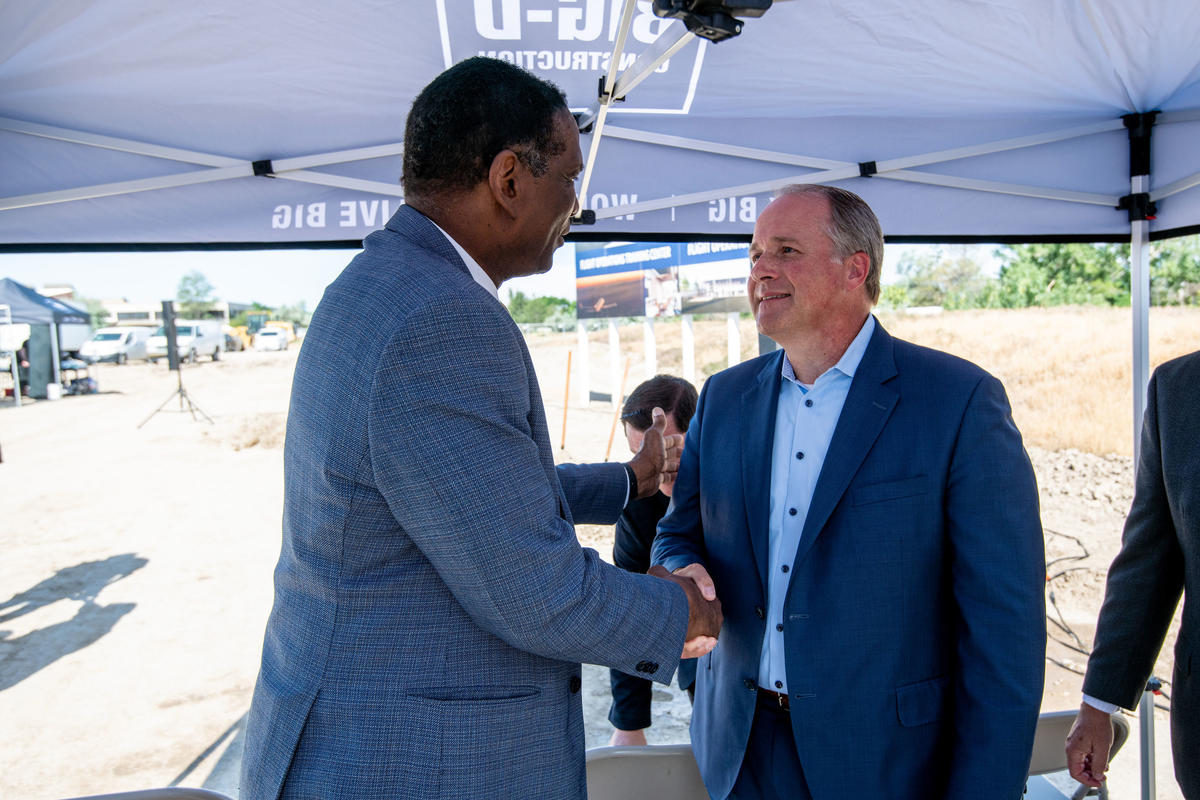 Delta E.V.P. and Chief of Operations John Laughter shakes hands with Utah representative Burgess Owens at the groundbreaking of Delta's&nbsp;new pilot training facility in its key Mountain West hub, Salt Lake City on Thursday, June 29.