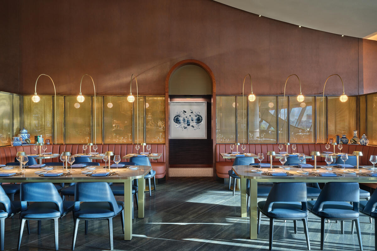The color palette of the Delta One Lounge reflects Boston’s academic heritage, with maroon shades and rich leather evoking the city’s classic learning institutions.